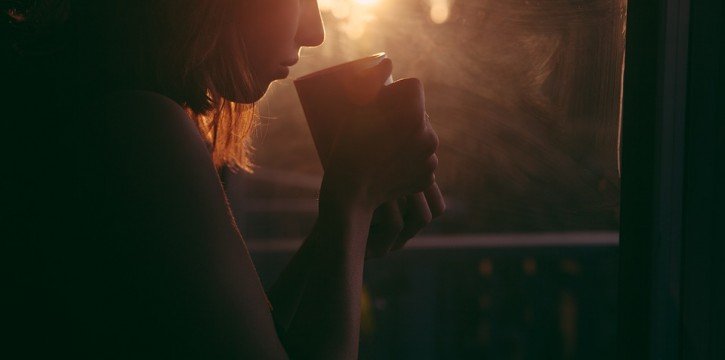 girl drinking coffee to warm up