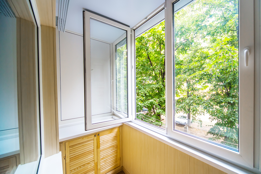 window of a home open to let in fresh air
