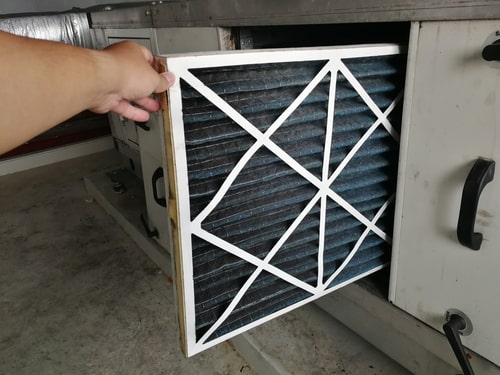 Man changes furnace filter